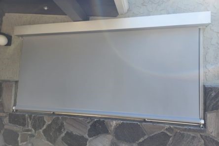 Wide-angle view of automatic window blinds installed on an exterior wall of an Oakland home, blending seamlessly with modern architecture.
